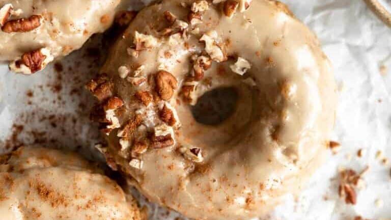 Donuts covered in cinnamon sugar and pecans.