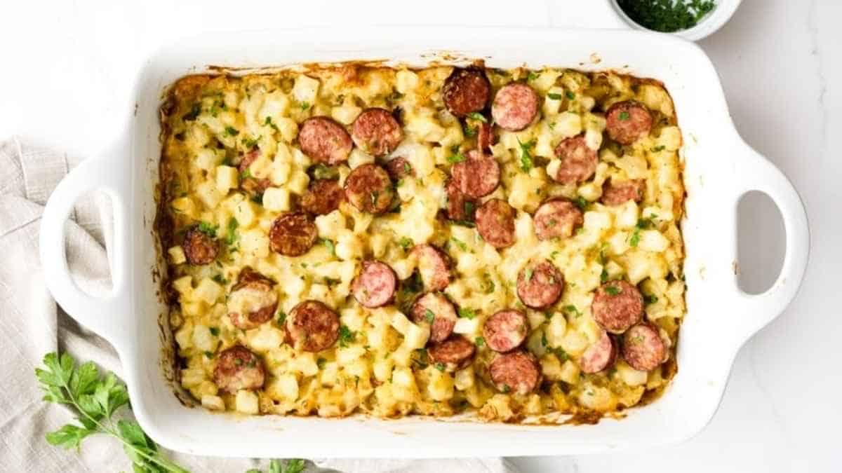 A casserole dish with sausage and macaroni and cheese.