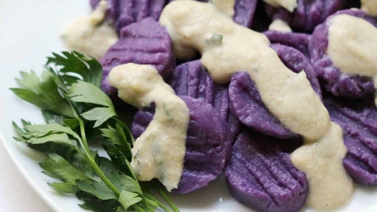 Purple Sweet Potato Gnocchi With Tahini Parsley Sauce. 