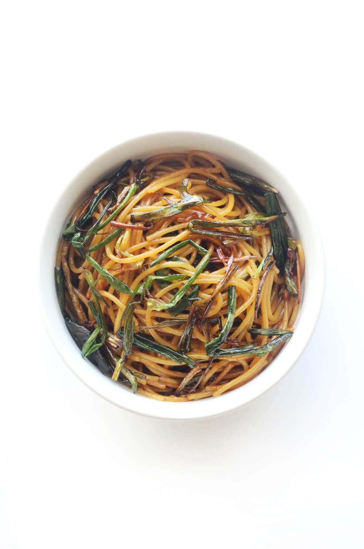 overhead view of bowl with gluten-free scallion oil noodles.
