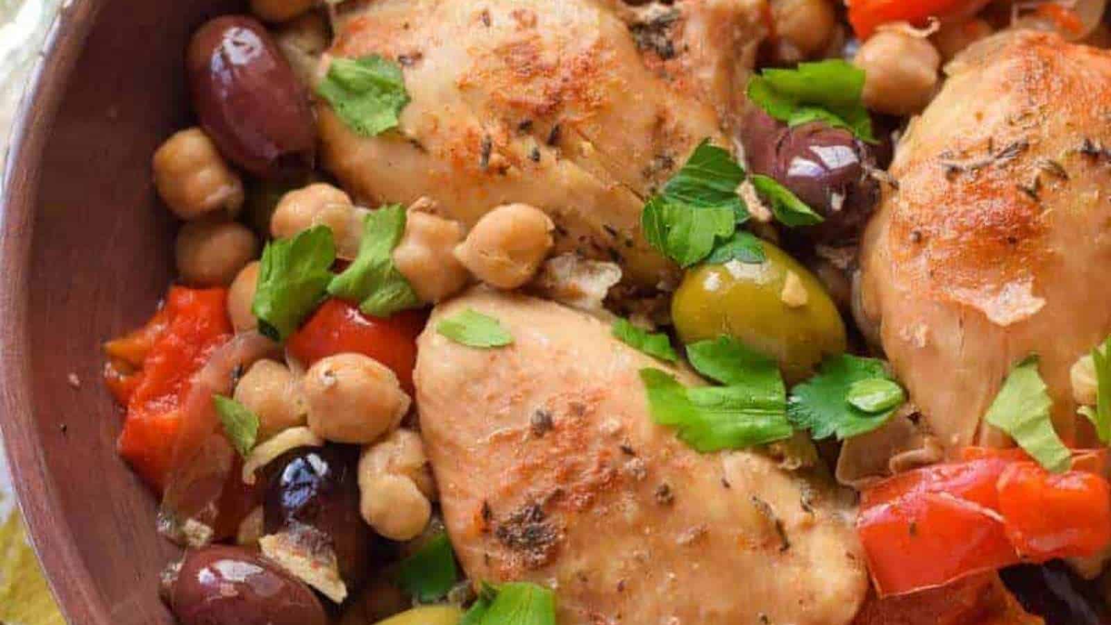 Chicken with chickpeas and tomatoes in a bowl.