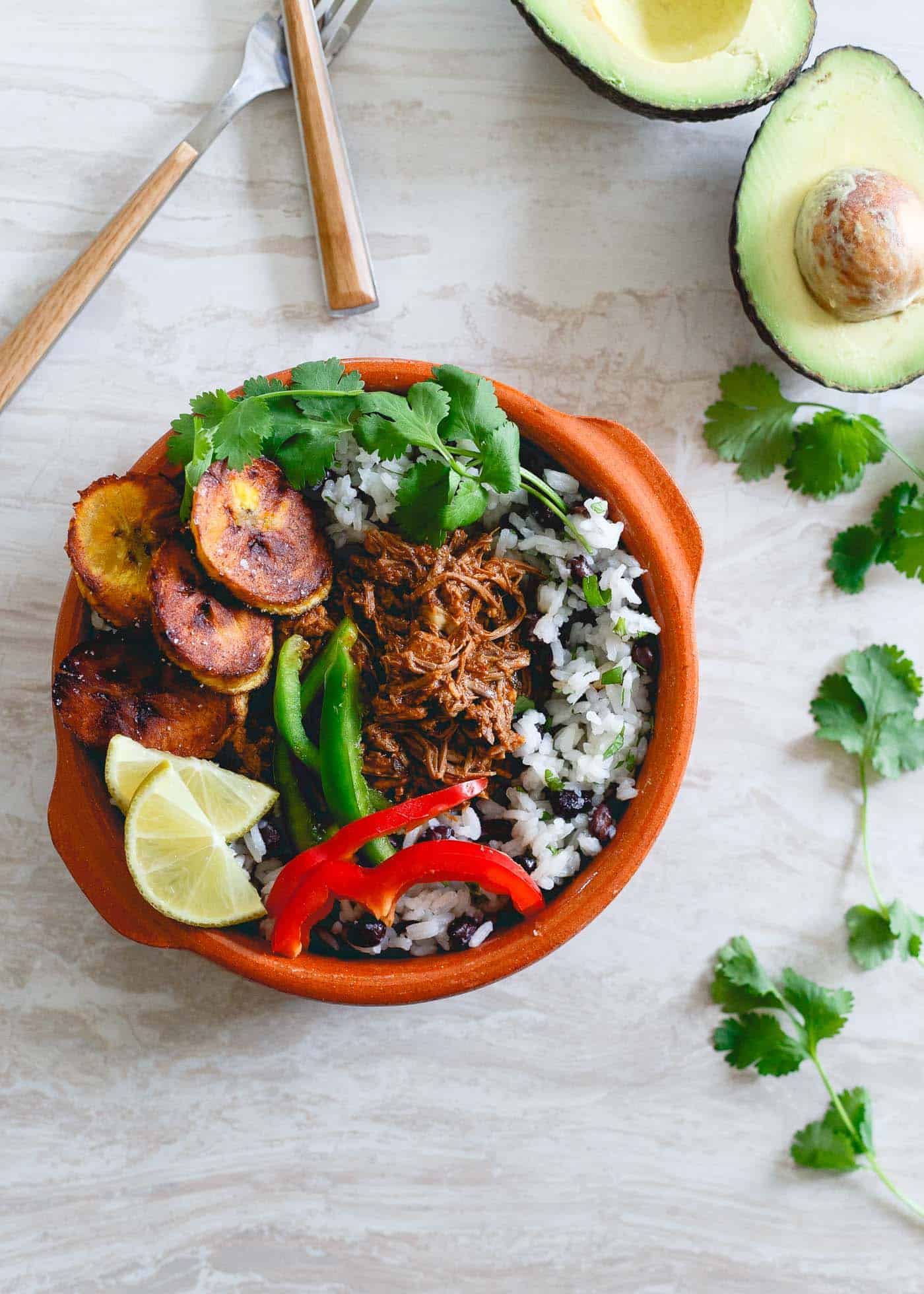 A bowl of rice and beans on a table.