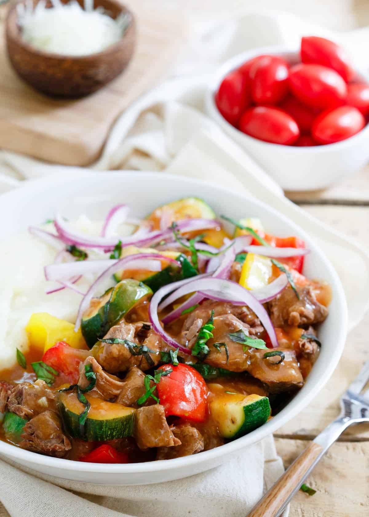 This summer beef stew is made in the slow cooker so the house stays cool. Enjoy this classic dish with a summer vegetable twist! / This summer beef stew is made in the slow cooker so the house stays cool. Enjoy this classic dish with a summer vegetable twist!
