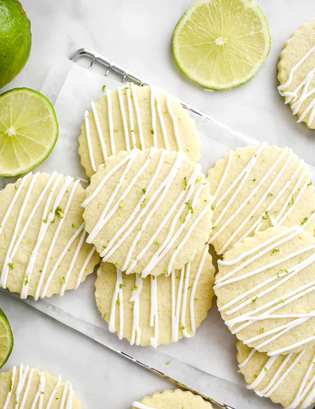 Unique lime sugar cookies with icing and lime slices.
