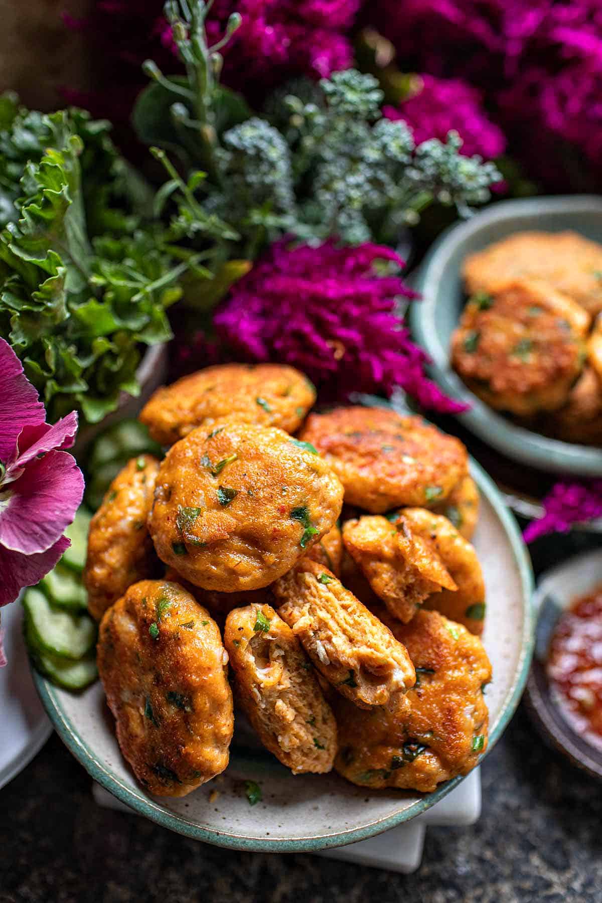 Thai fish cakes on a platter for serving. 
