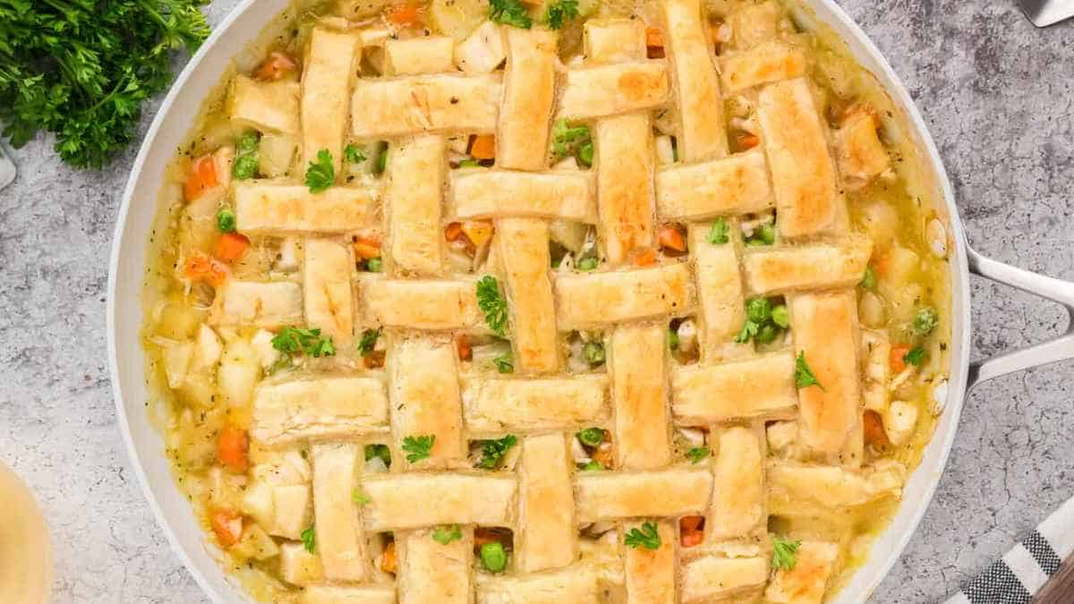 Chicken pot pie in a skillet with parsley.