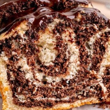 A slice of chocolate swirl cake on a plate.