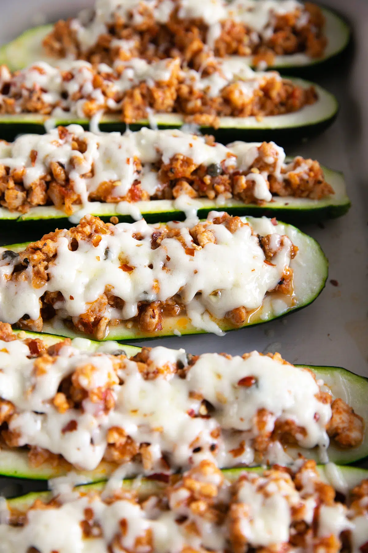 Zucchini boats stuffed with meat and cheese.