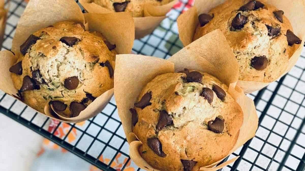 Chocolate chip muffins on a cooling rack.