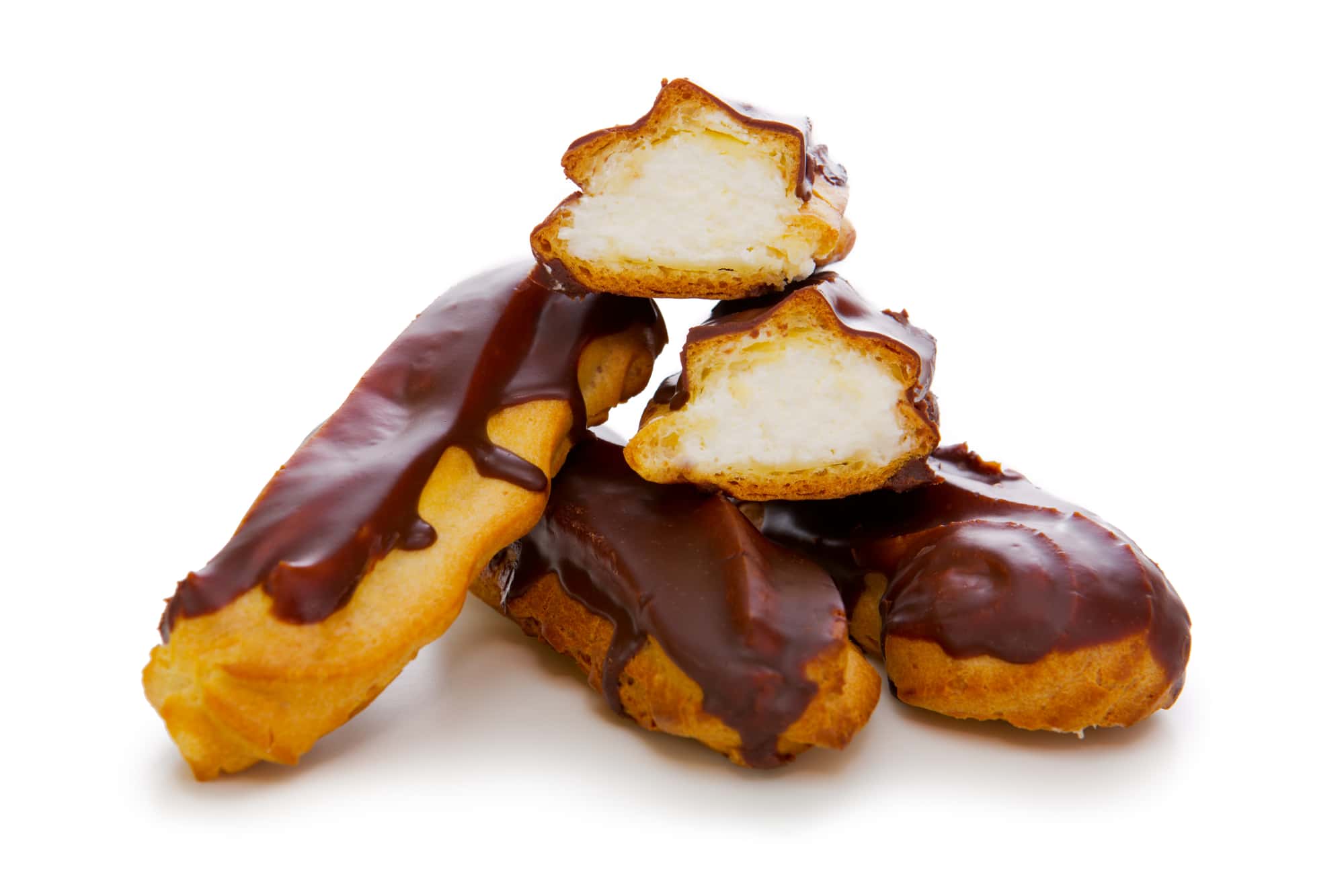 A pile of chocolate covered eclairs on a white background.