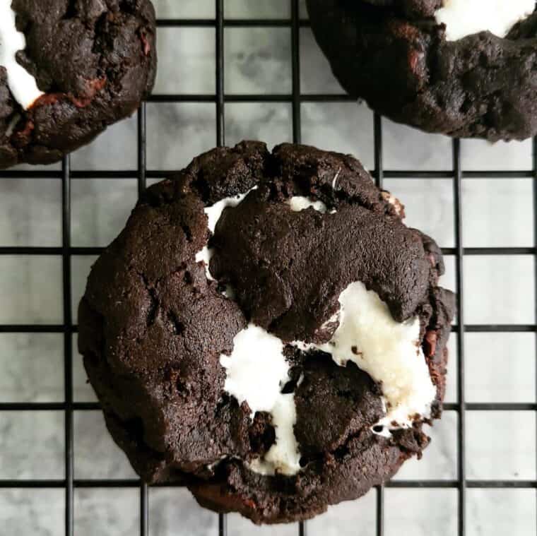 Unique chocolate ice cream cookies on a cooling rack.