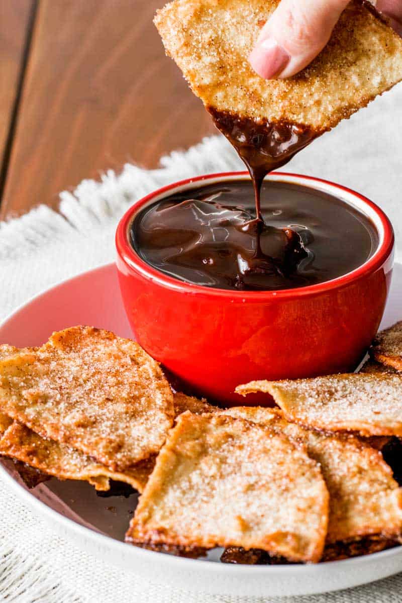 Cinnamon Sugar Tortilla Chips! These baked cinnamon tortilla chips are easy to make and perfect for dipping in all sorts of sweet desserts and frostings. Plus, they're a great and creative way to use up extra tortillas. 
