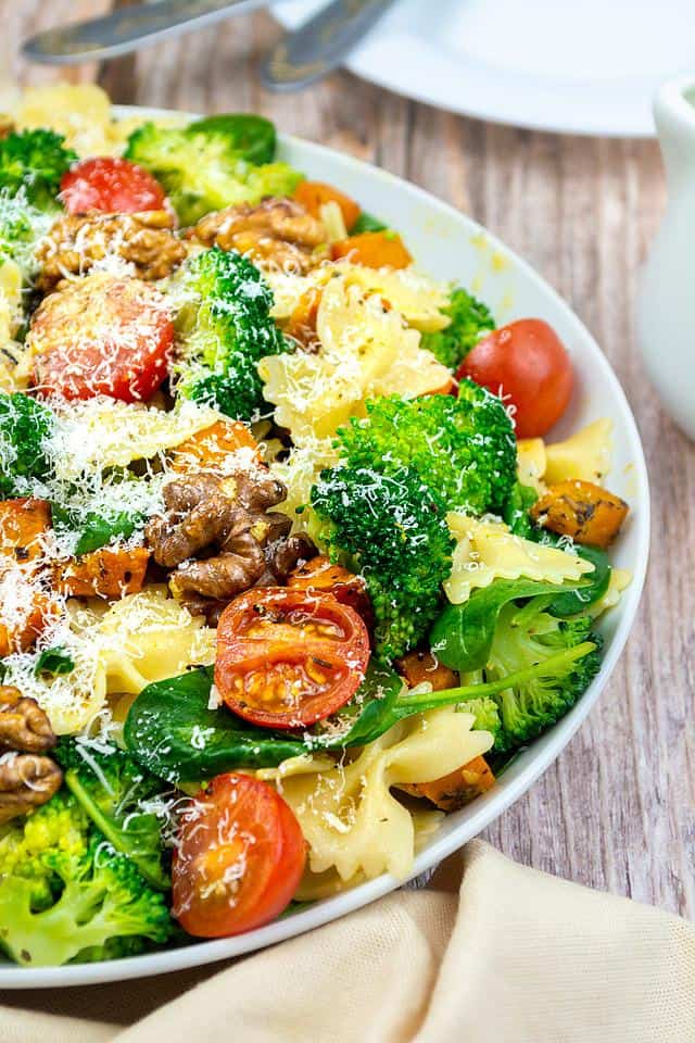 Food blogger, Bella Bucchiotti of xoxoBella, shares a recipe for broccoli pasta salad with roasted squash and walnuts. You will love this gluten free vegan pasta salad. 
