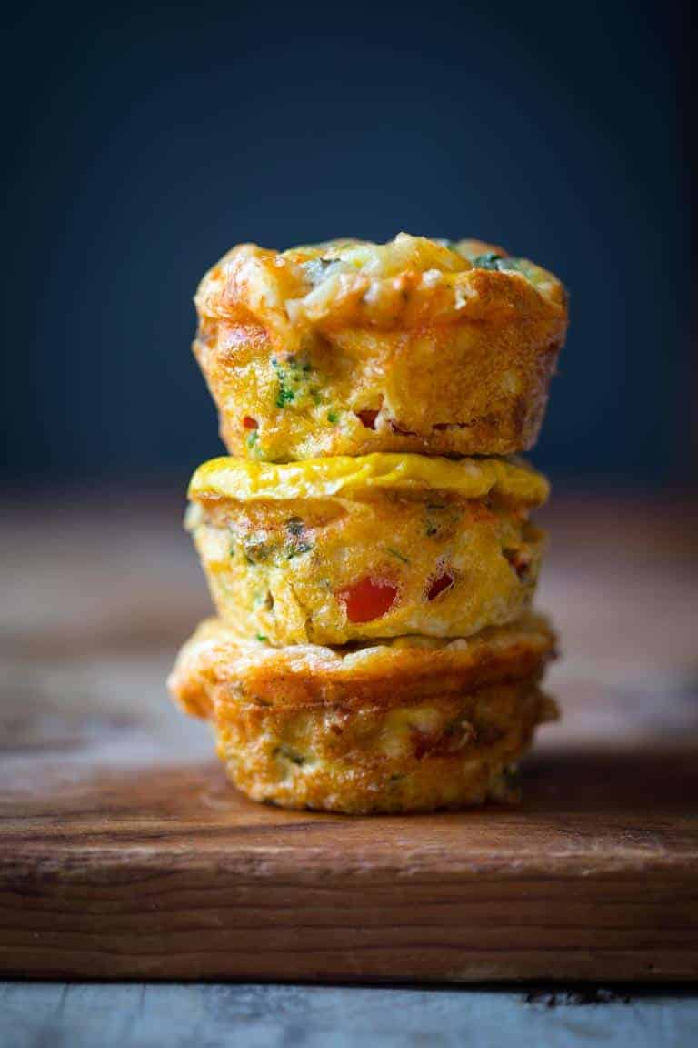 High Protein Grab and Go Veggie Egg Cups stacked on top of each other.
