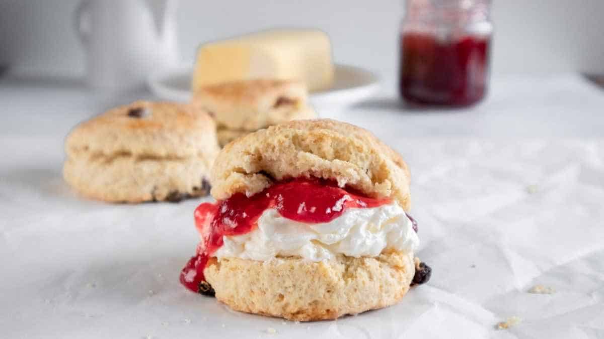 Scones with jam and cream on top.