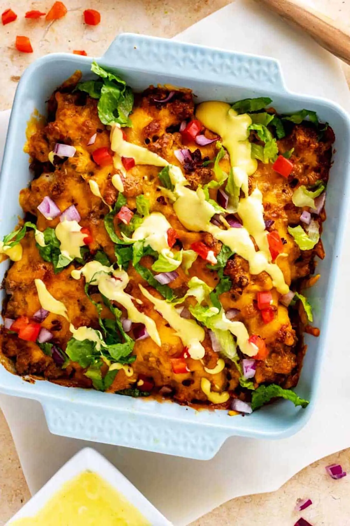 Overhead photo of Keto Cheeseburger Casserole in a light blue casserole dish. 
