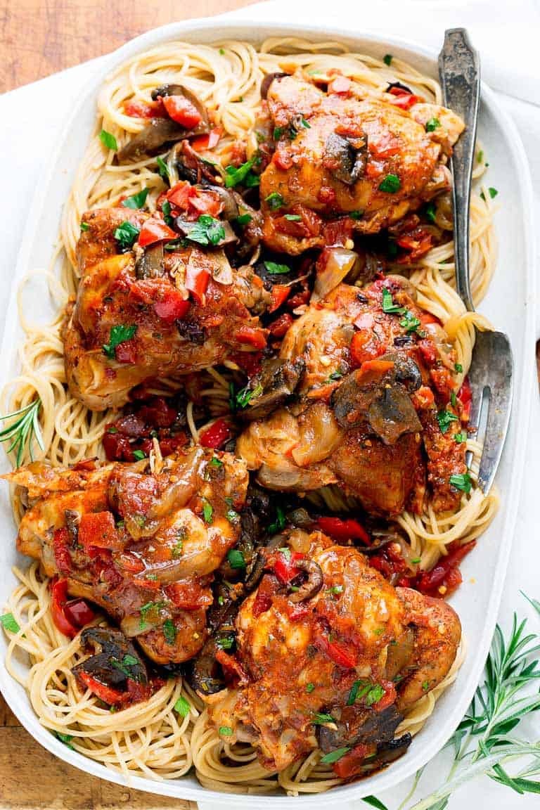 A platter with chicken cacciatore 
