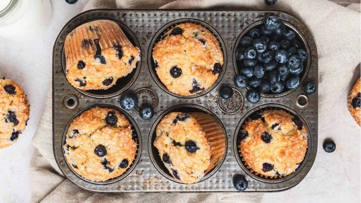 Blueberry muffins in a muffin tin.