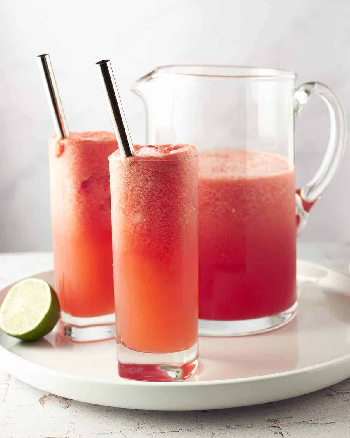 Two glasses of watermelon juice, perfect for summer refreshment.