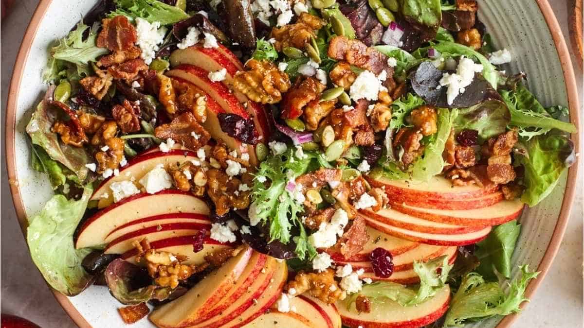 A salad with apples, walnuts and feta cheese.