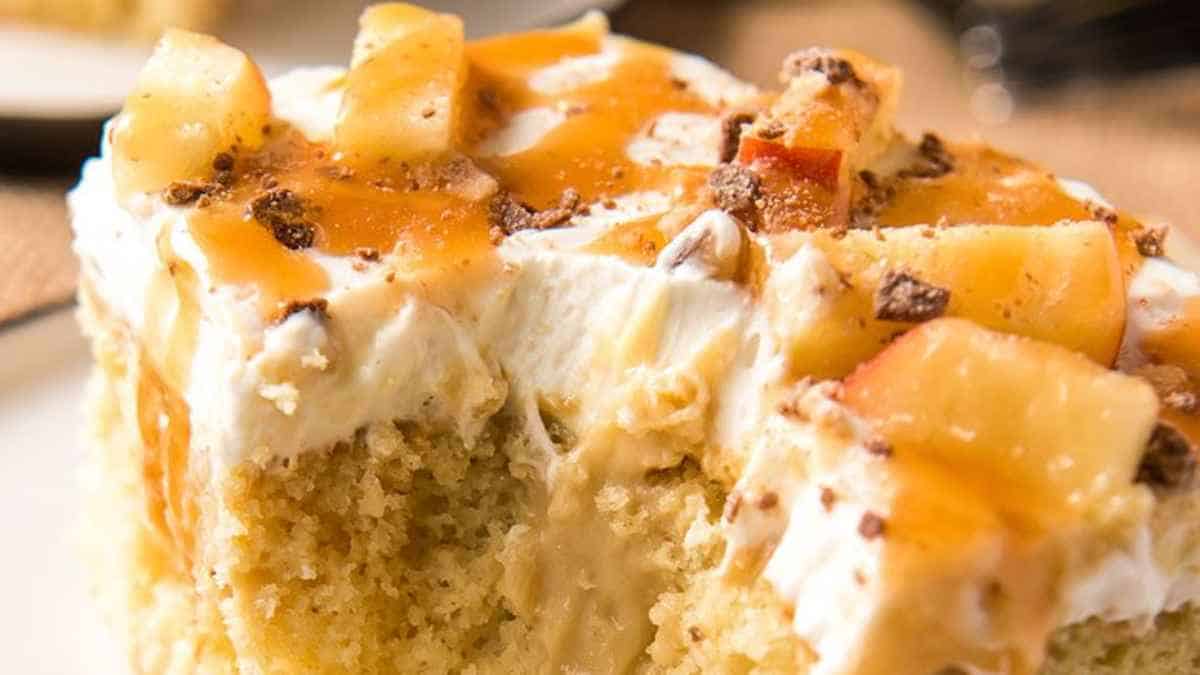 A slice of caramel apple cake on a plate.