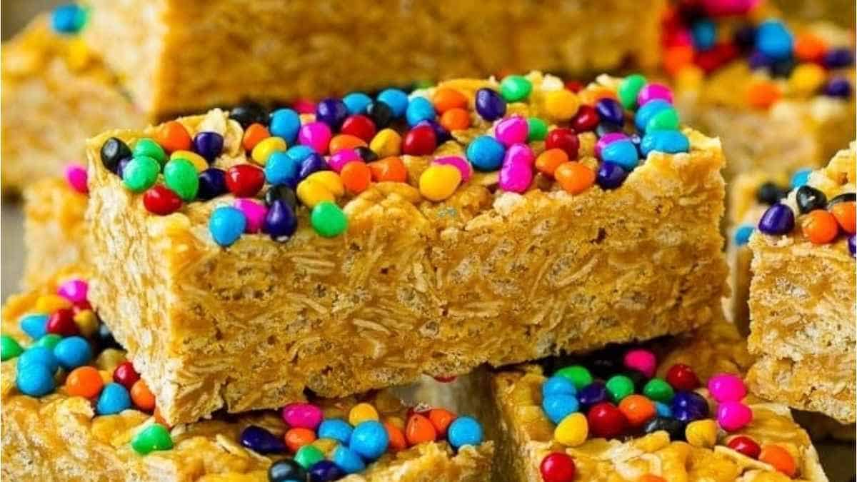 A stack of raisin raisin granola bars with colorful sprinkles.