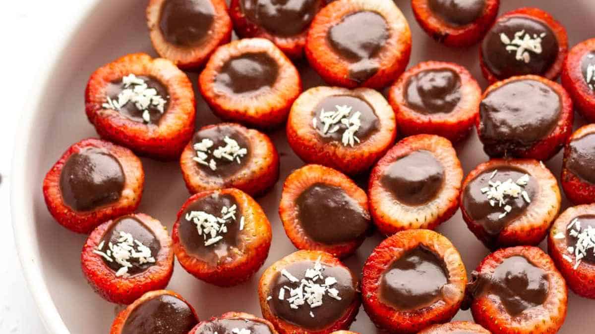 A group of strawberries covered in chocolate.