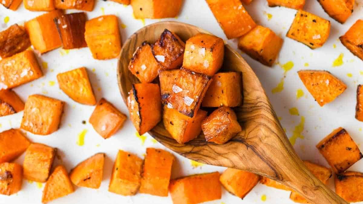 Roasted sweet potatoes in a wooden spoon.
