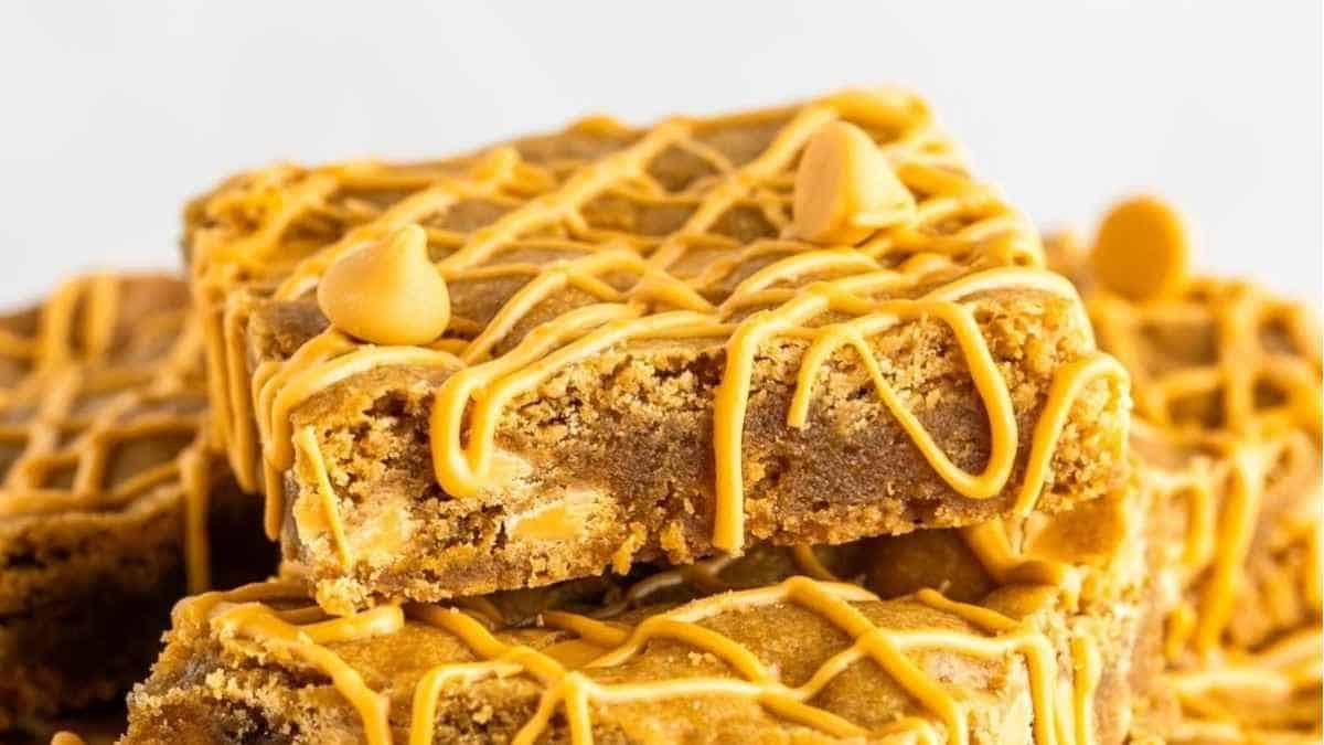 Peanut butter cookie bars stacked on top of each other.