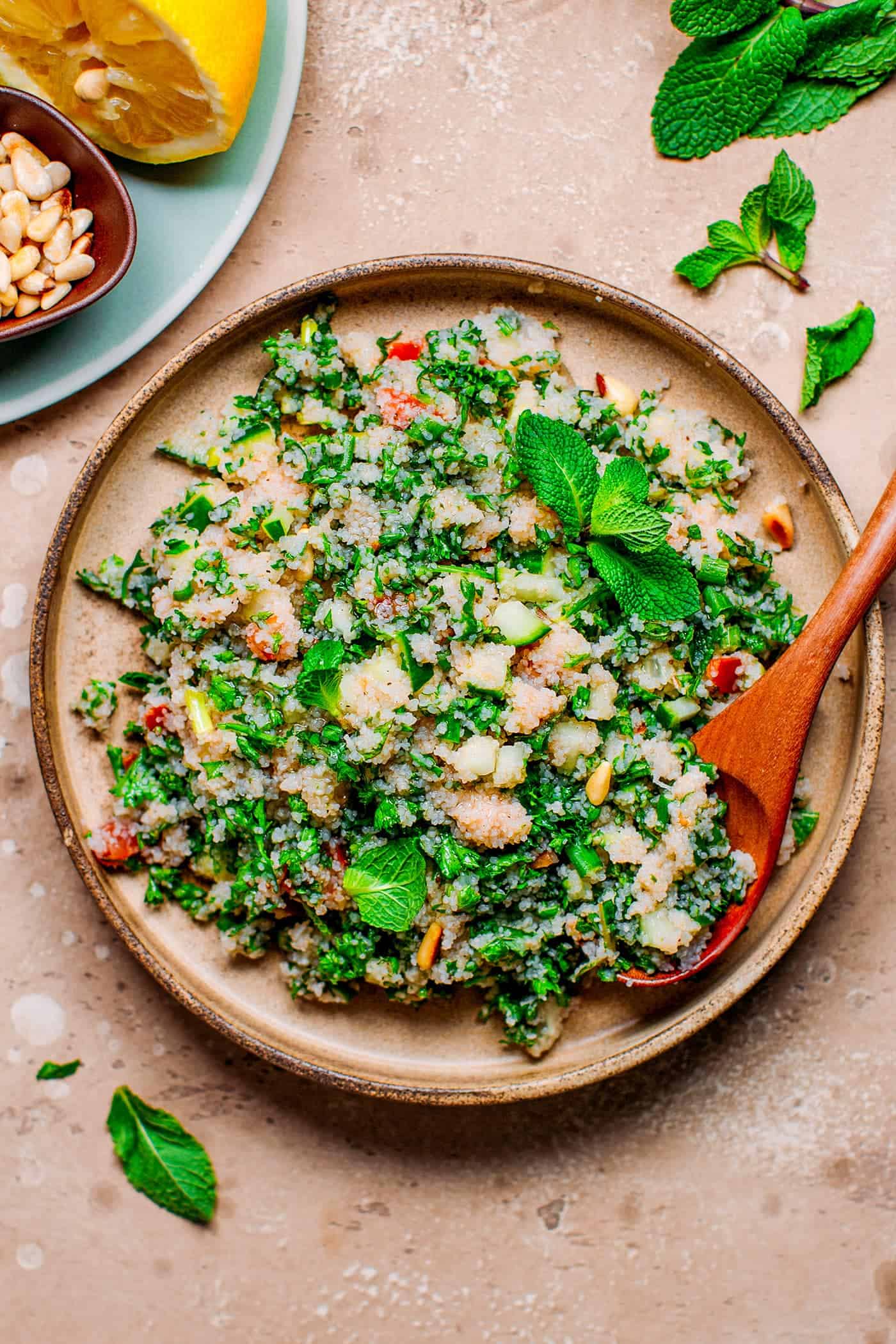 Fonio tabbouleh with fresh herbs on a plate.