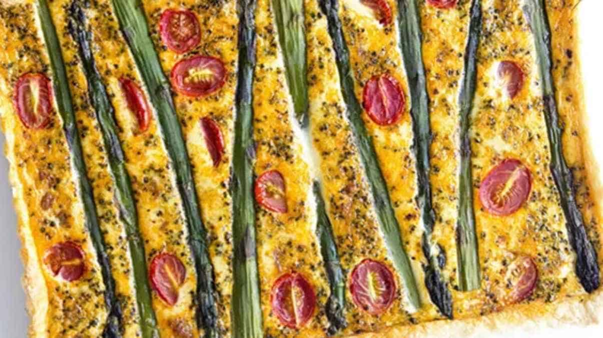 Savory tart with asparagus and cherry tomatoes.