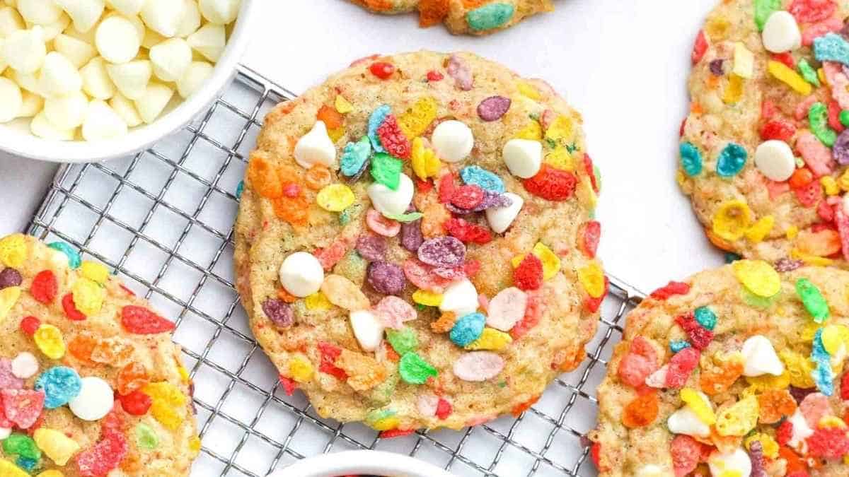 Colorful cookies on a cooling rack.
