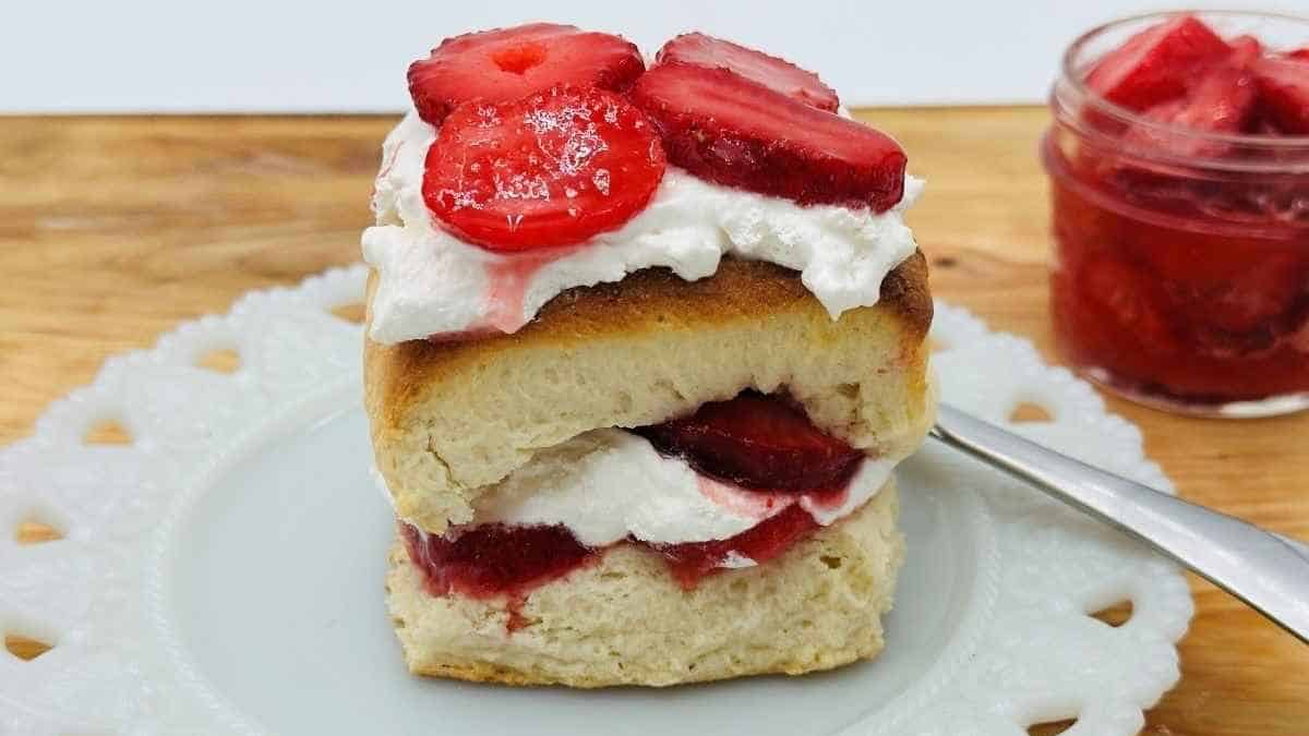 A slice of strawberry shortcake on a plate.