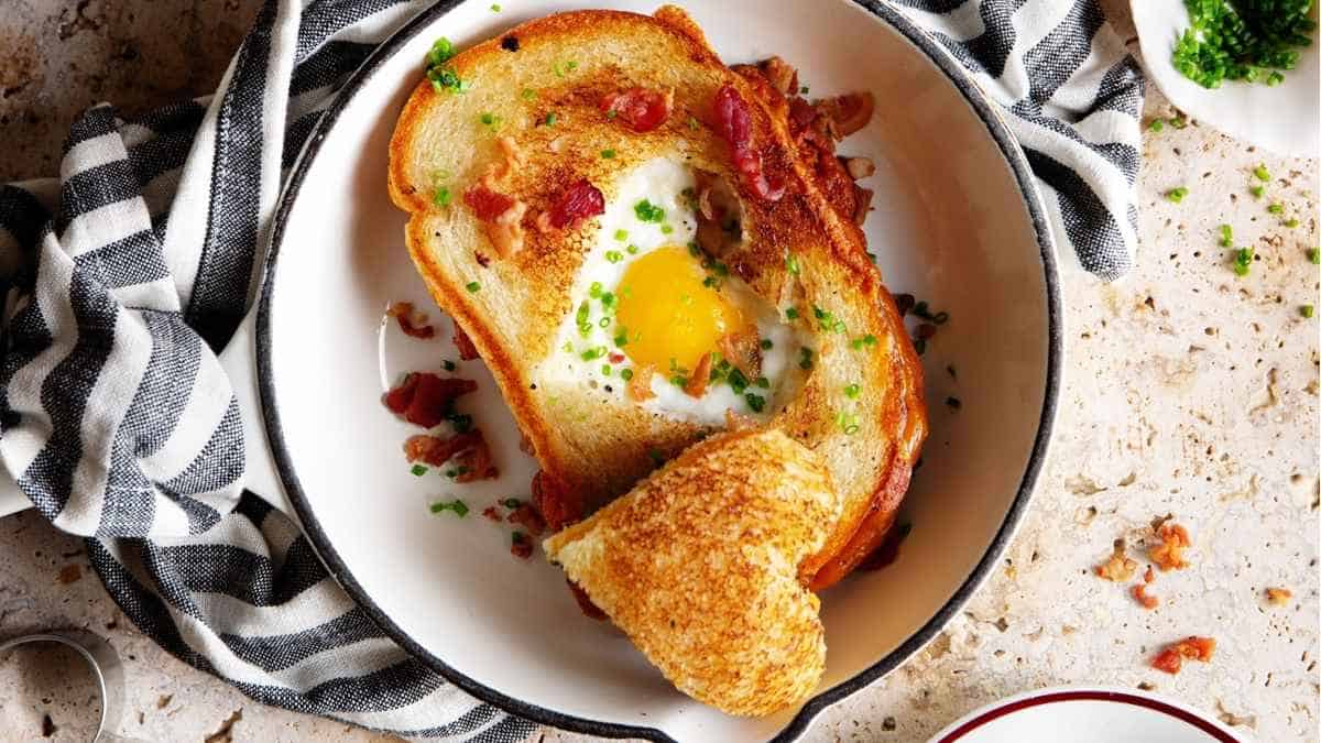 A dish with an egg and bacon on it.