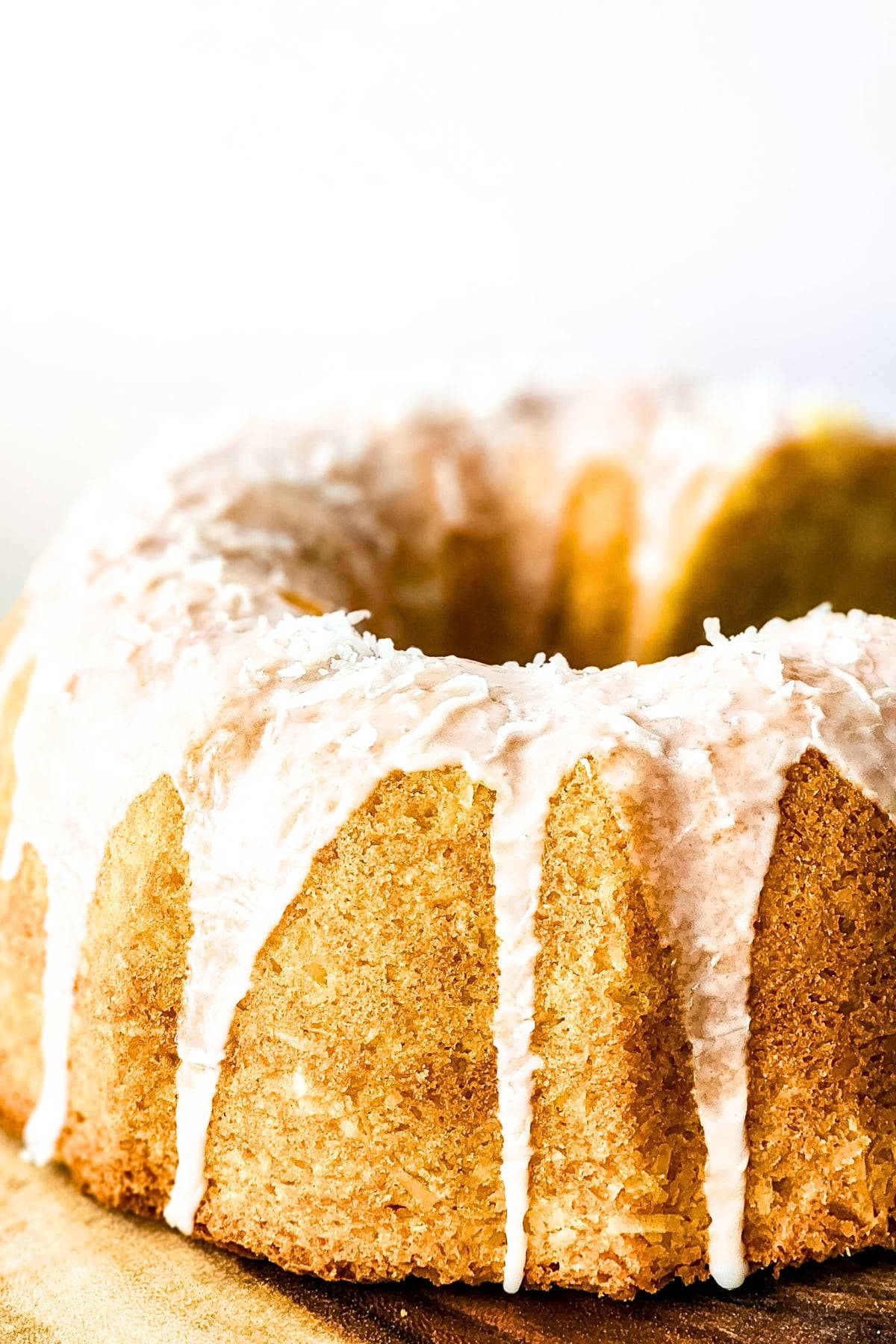 Up close view of glazed coconut cake. / Easy Gluten-Free Coconut Cake (Dairy-Free)
