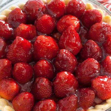 A pie with strawberries in it.
