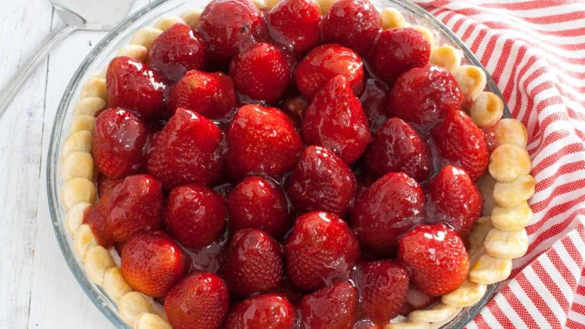 A pie with strawberries in it.