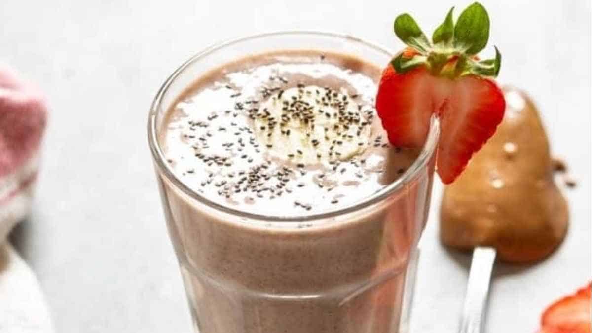 A chocolate smoothie with strawberries and chia seeds.