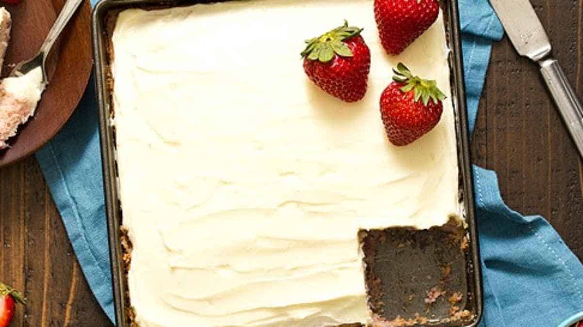 A cake with strawberries on top.
