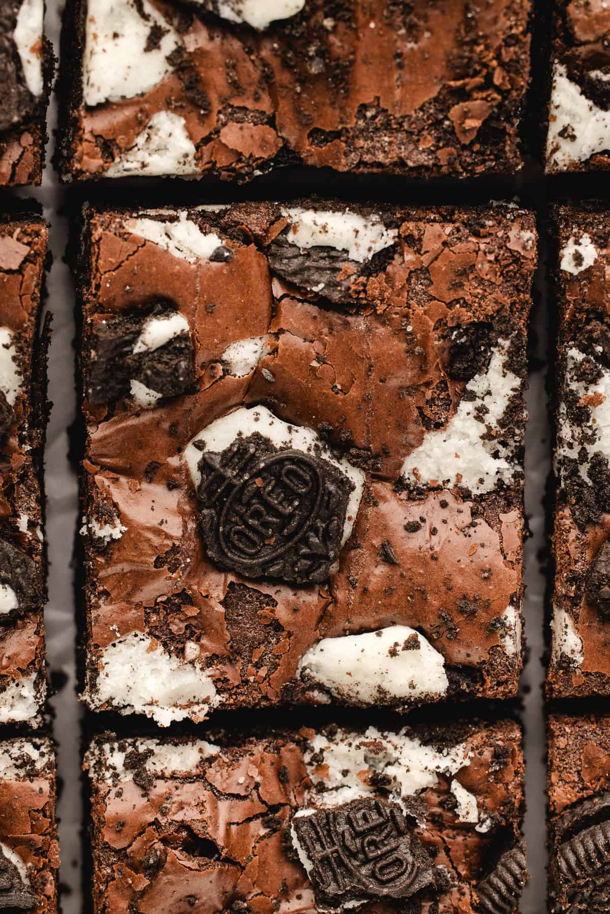 Close-up of chocolate brownies topped with crushed cookies.