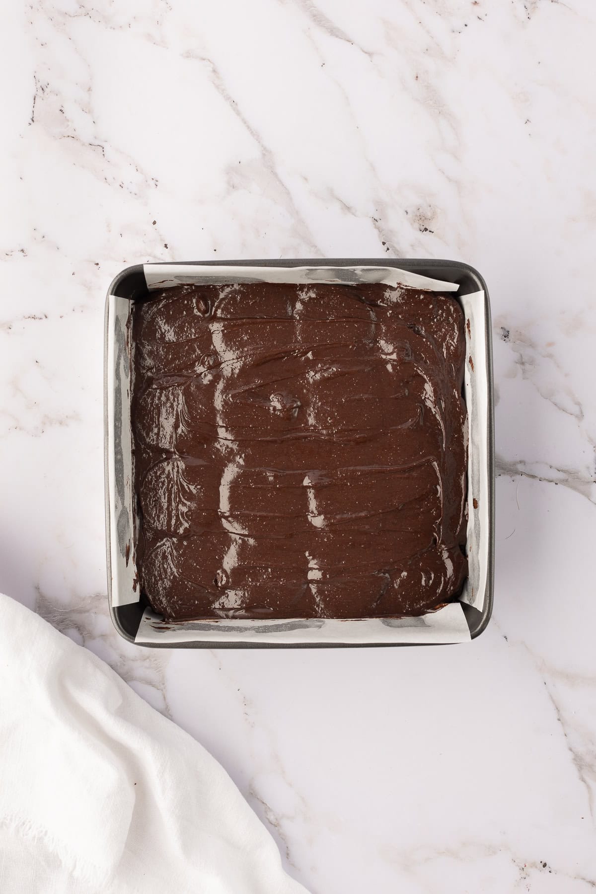 batter layered over oreo brownies