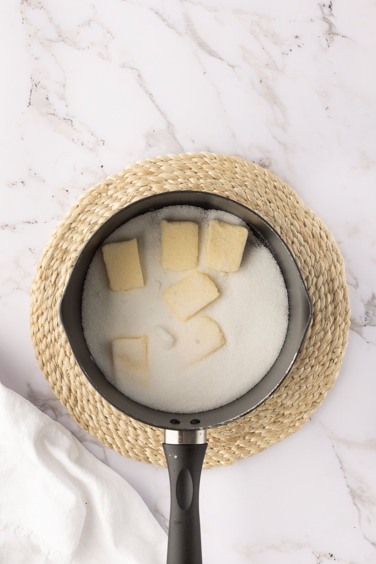 butter melting with milk in pot