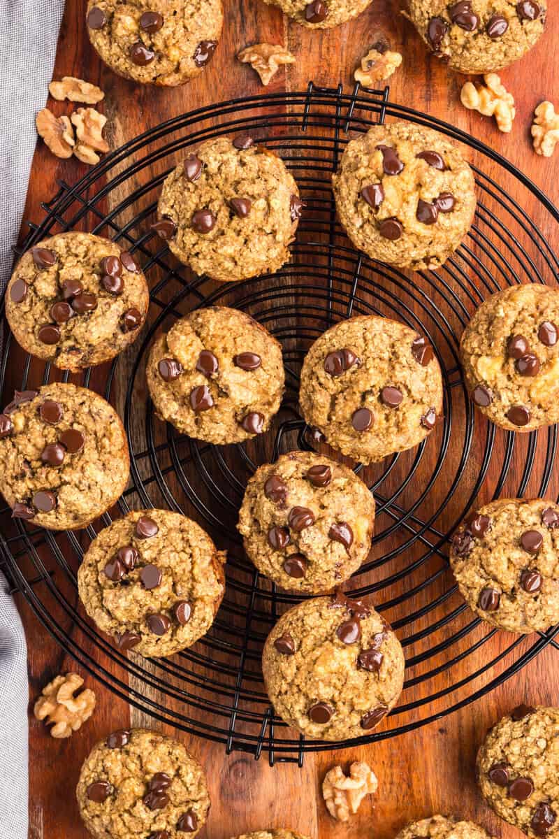 muffins with chocolate chips on a cooking rack
