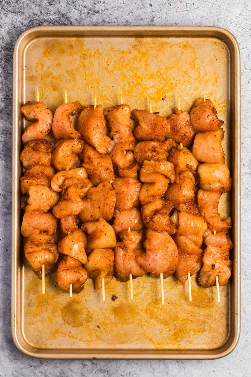 raw chicken on skewers