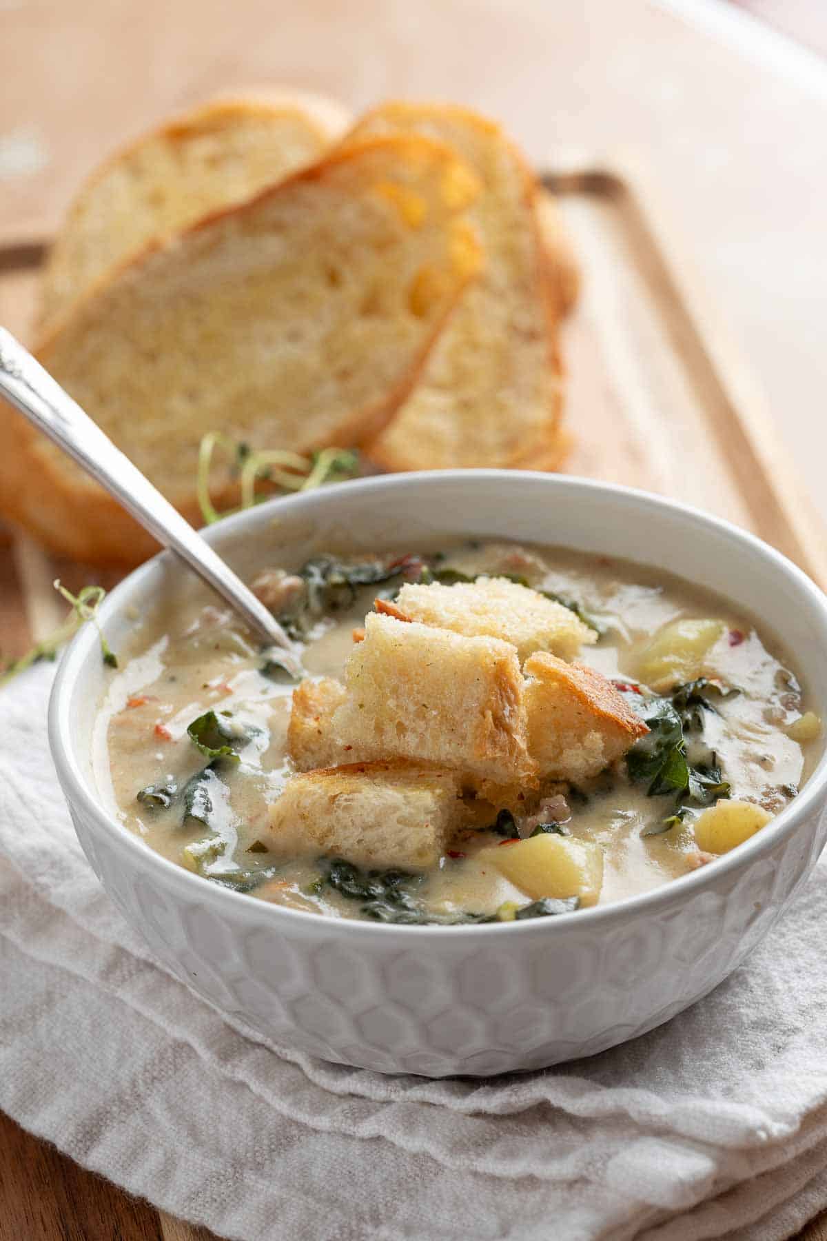 italian soup in a bowl with a spoon
