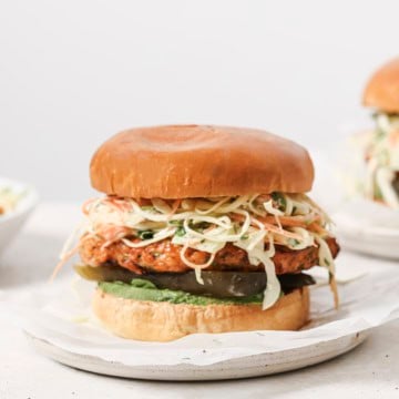 air fryer chicken burger with slaw on a white plate