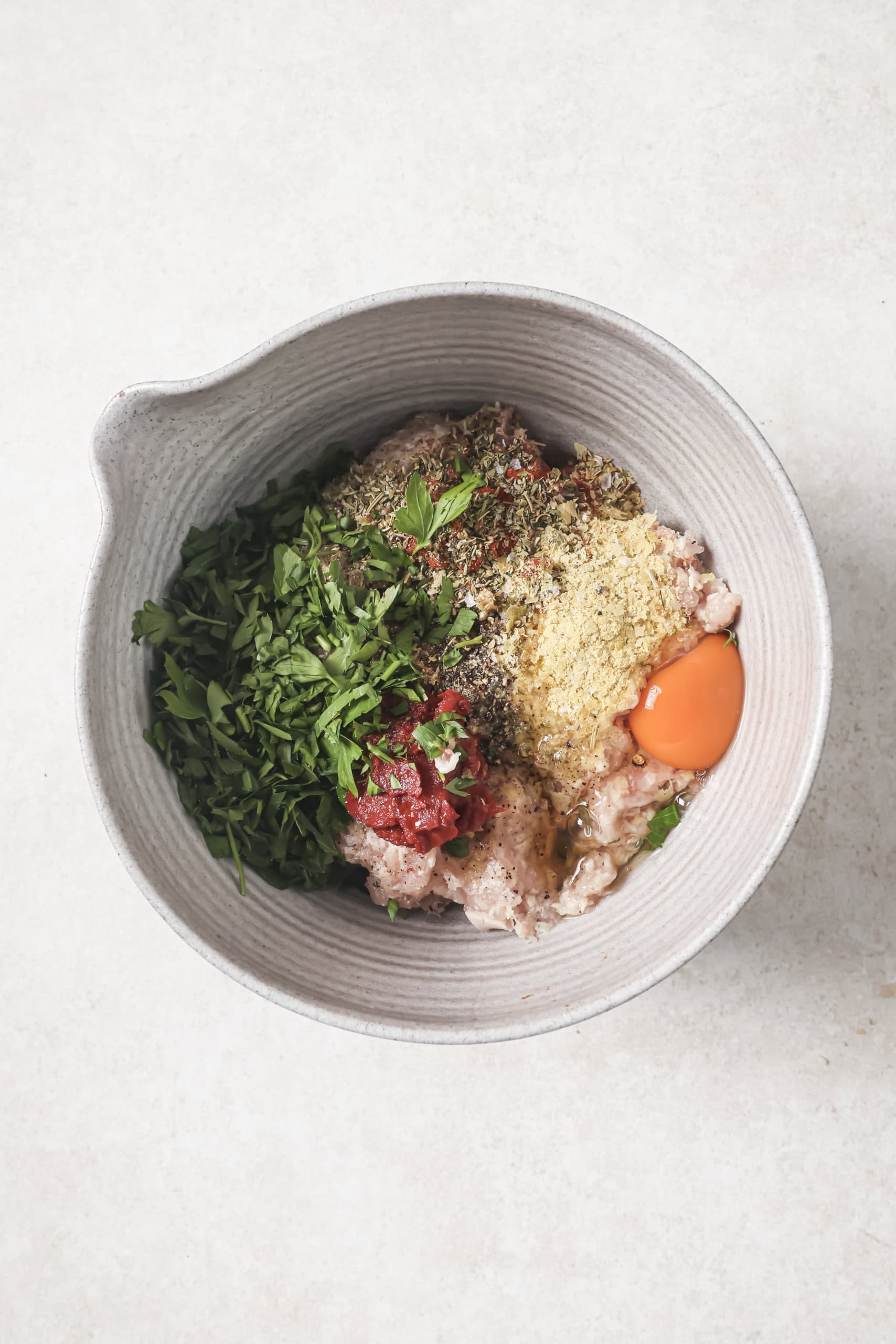 ingredients for chicken burgers in a bowl