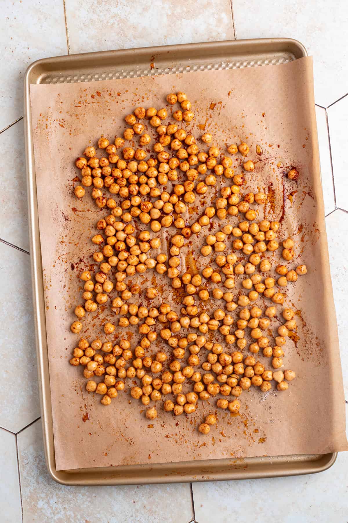 chickpeas on a sheet pan with parchment paper