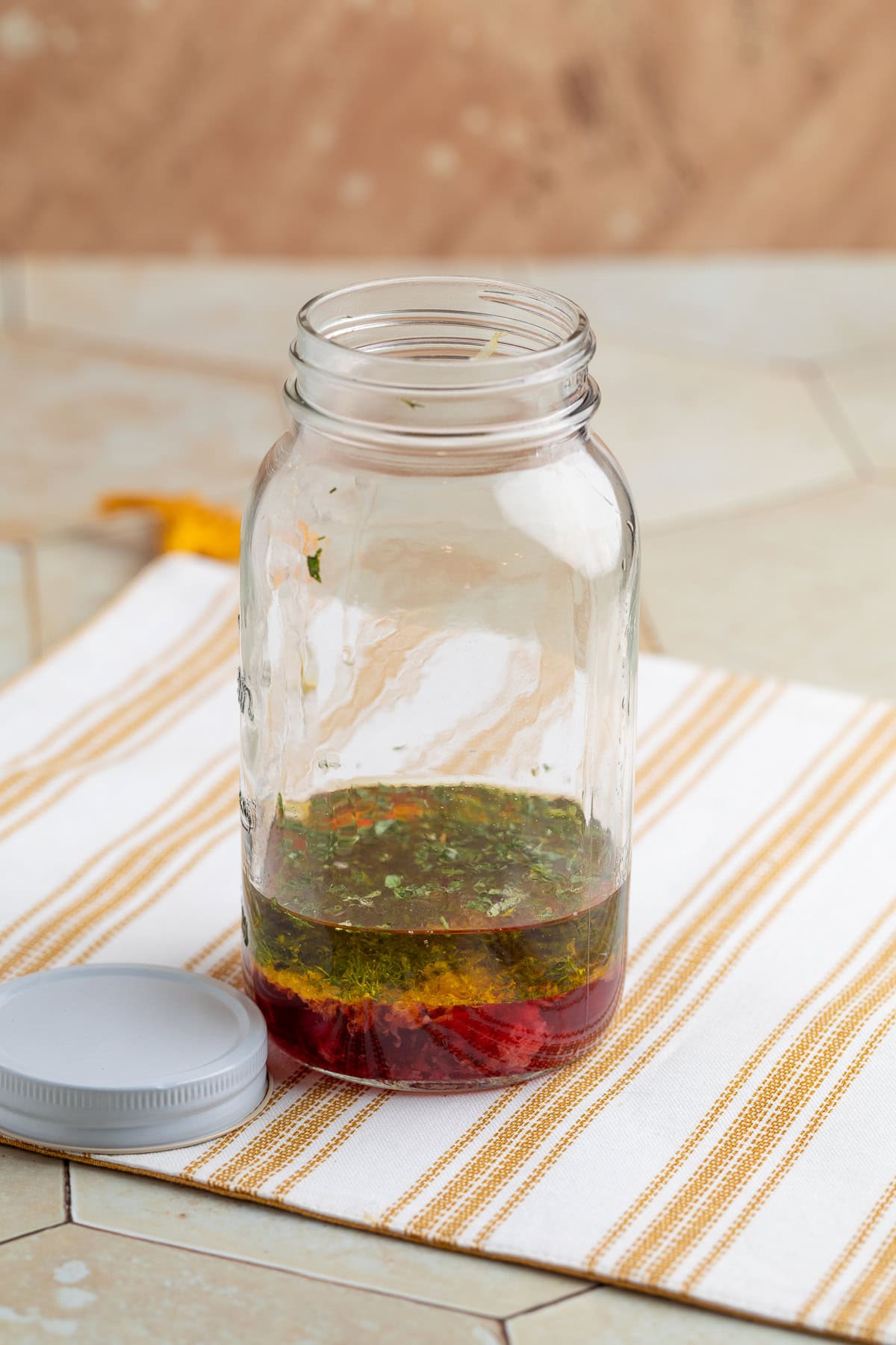 greek dressing ingredients in a mason jar