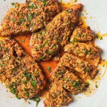 parmesan chicken sliced on a plate